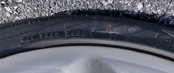 Tyre bearing the DOT code Y98N N8R0 2916